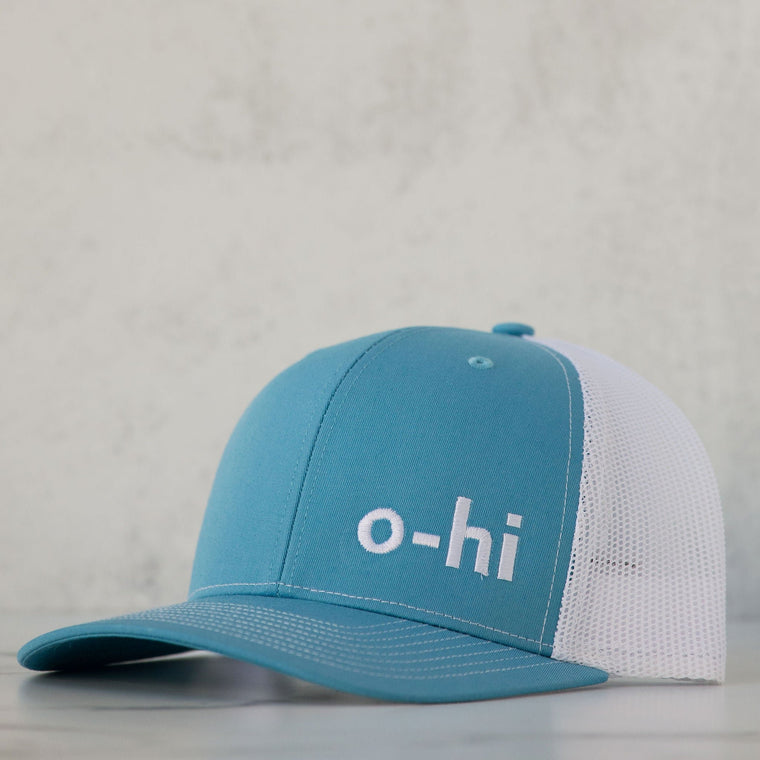 Blue and white o-hi hat against a neutral background