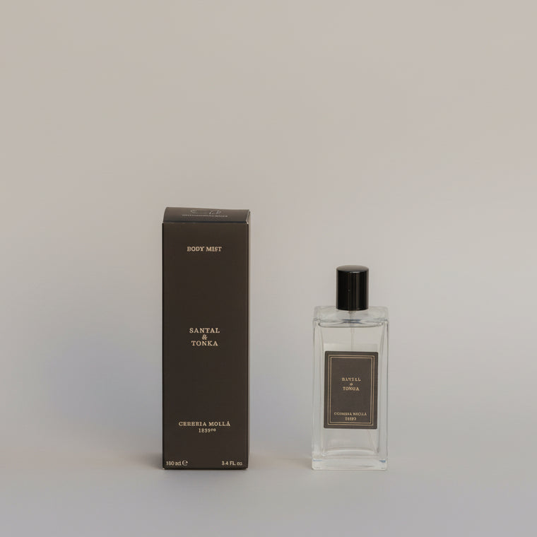 Perfume bottle and packaging labeled 'Santal & Tonka' on a plain background