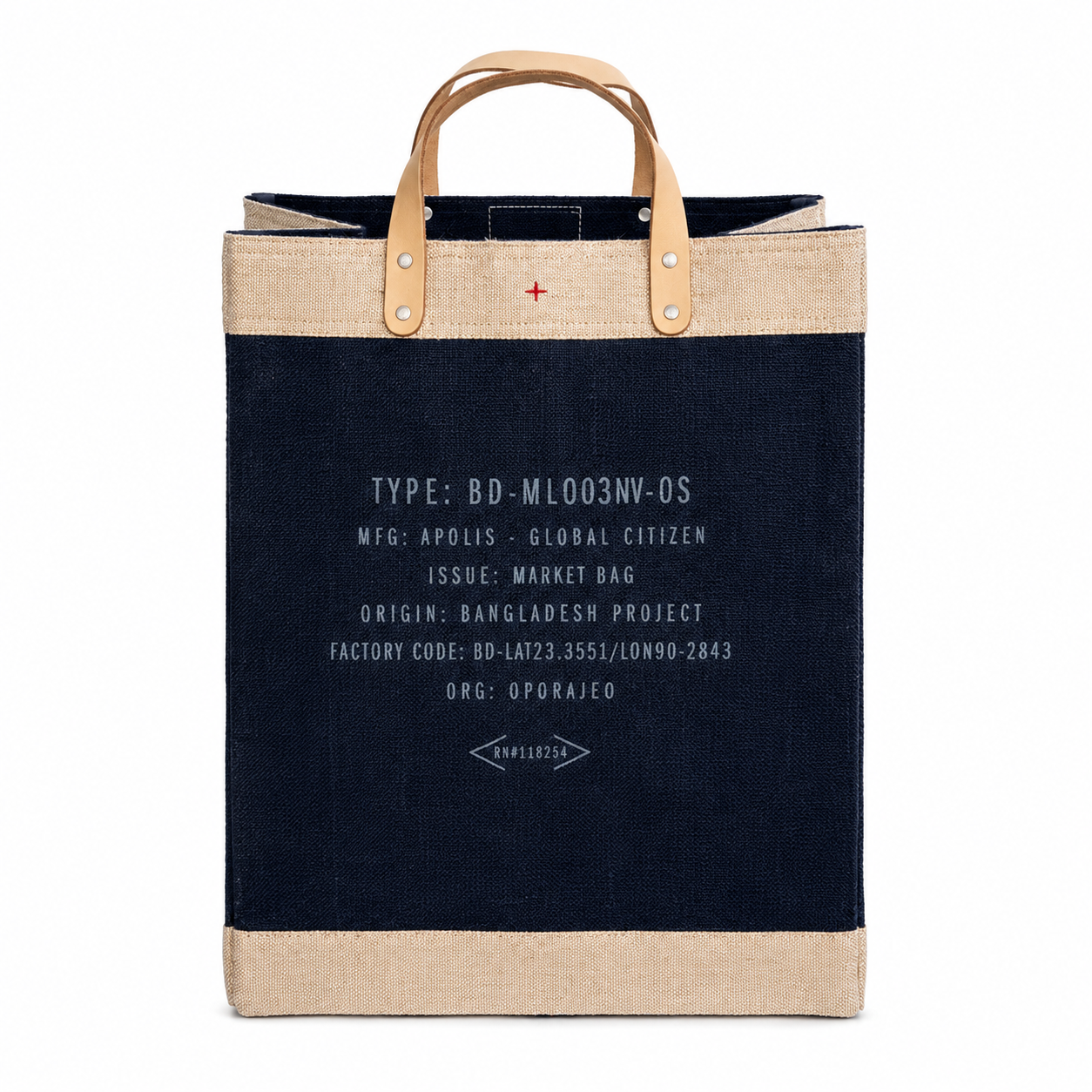 A canvas tote bag with a dark navy blue body, natural beige jute trim at the top and bottom, and tan leather handles. The front features white printed text and a small red cross symbol.