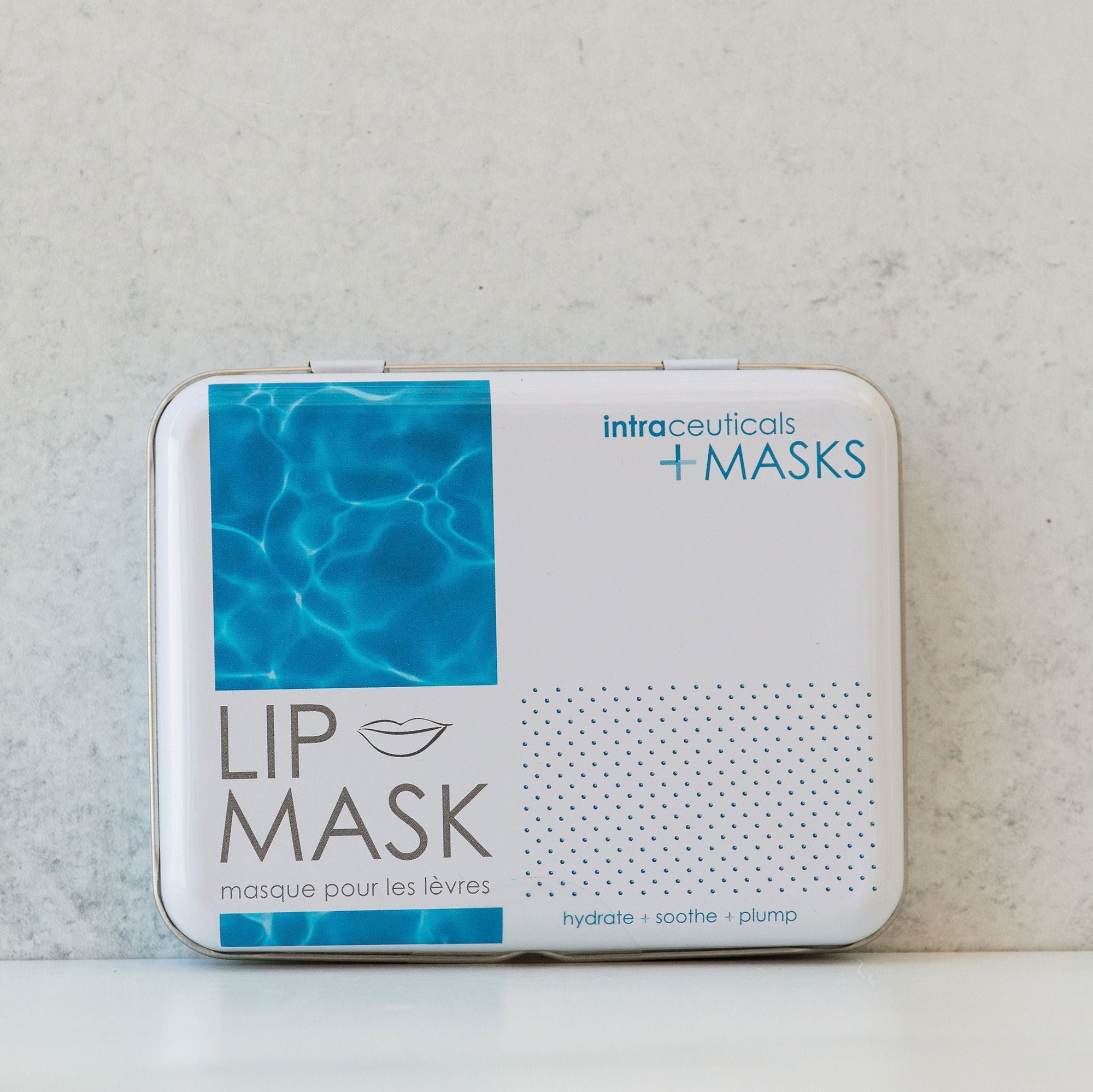 A rectangular container of Intraceuticals Lip Masks, with a blue and white design, depicting lips on the front.