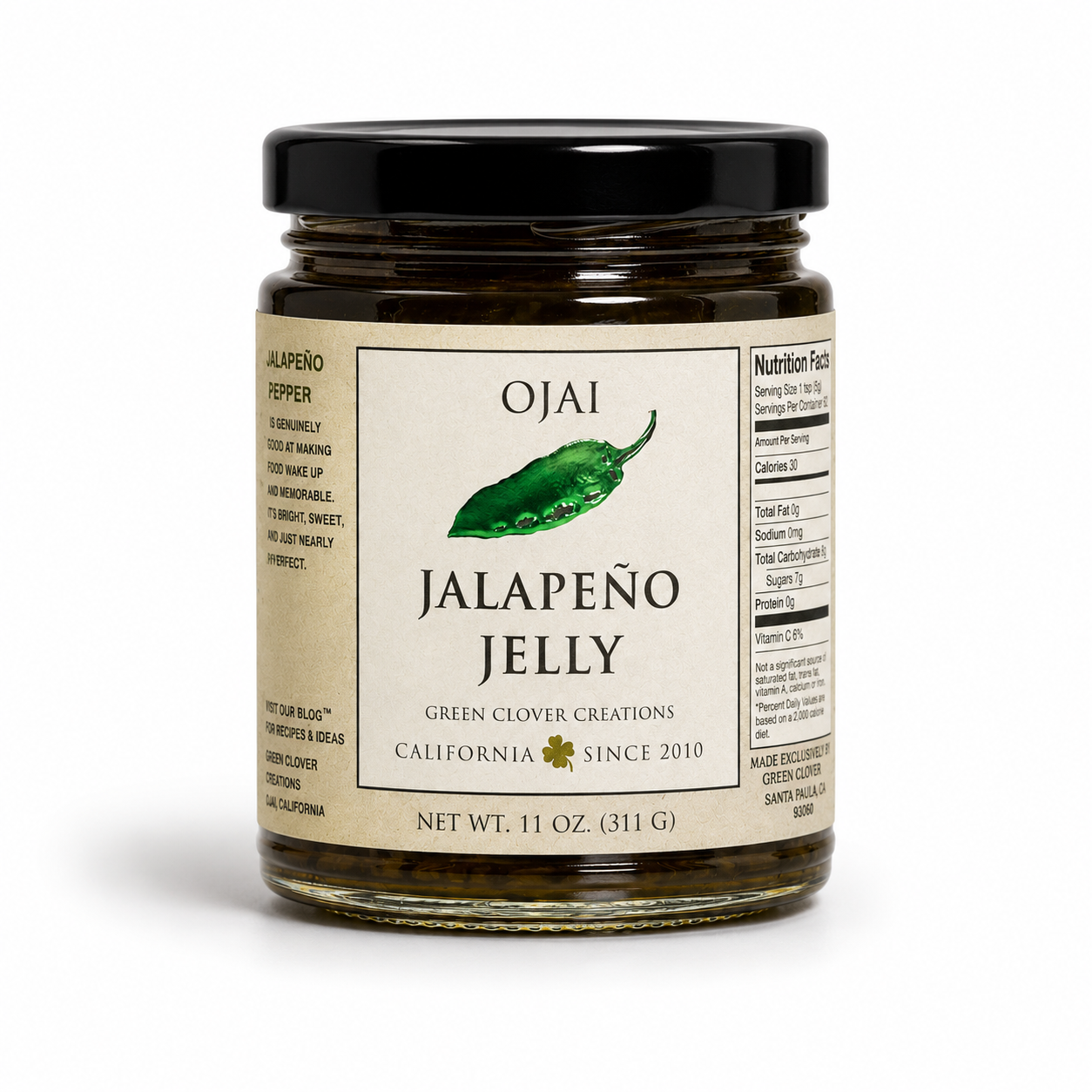 A glass jar of Ojai Jalapeño Jelly with a black lid and a cream-colored label featuring a green jalapeño illustration, set against a plain white background.