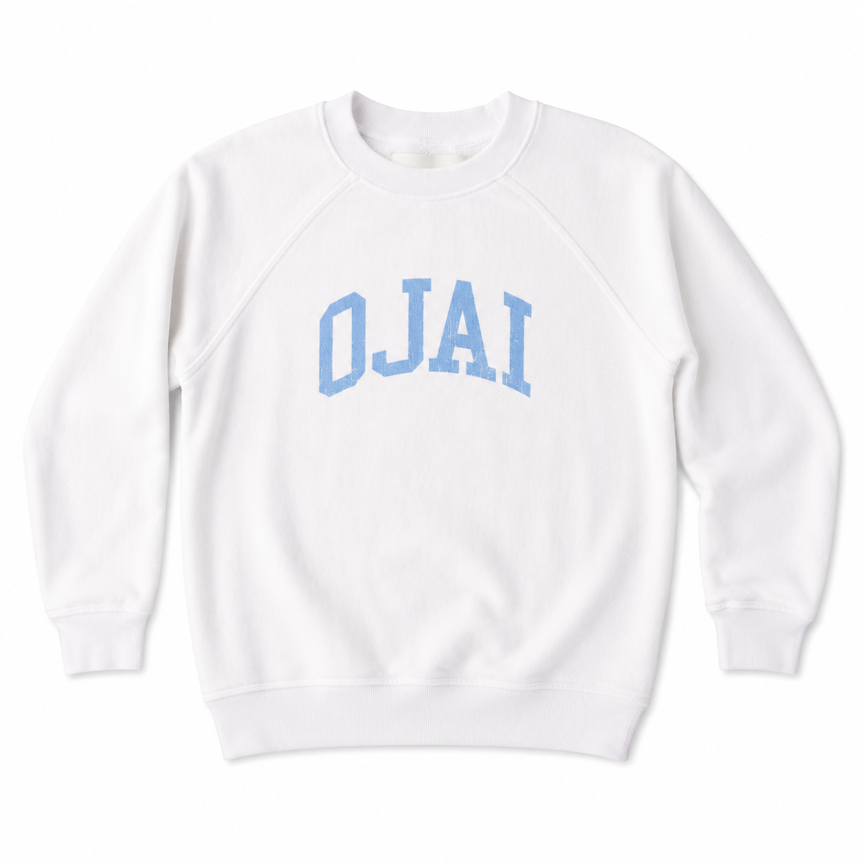 A white crewneck sweatshirt with 'OJAI' printed in light blue varsity block letters across the chest, displayed flat against a white background.