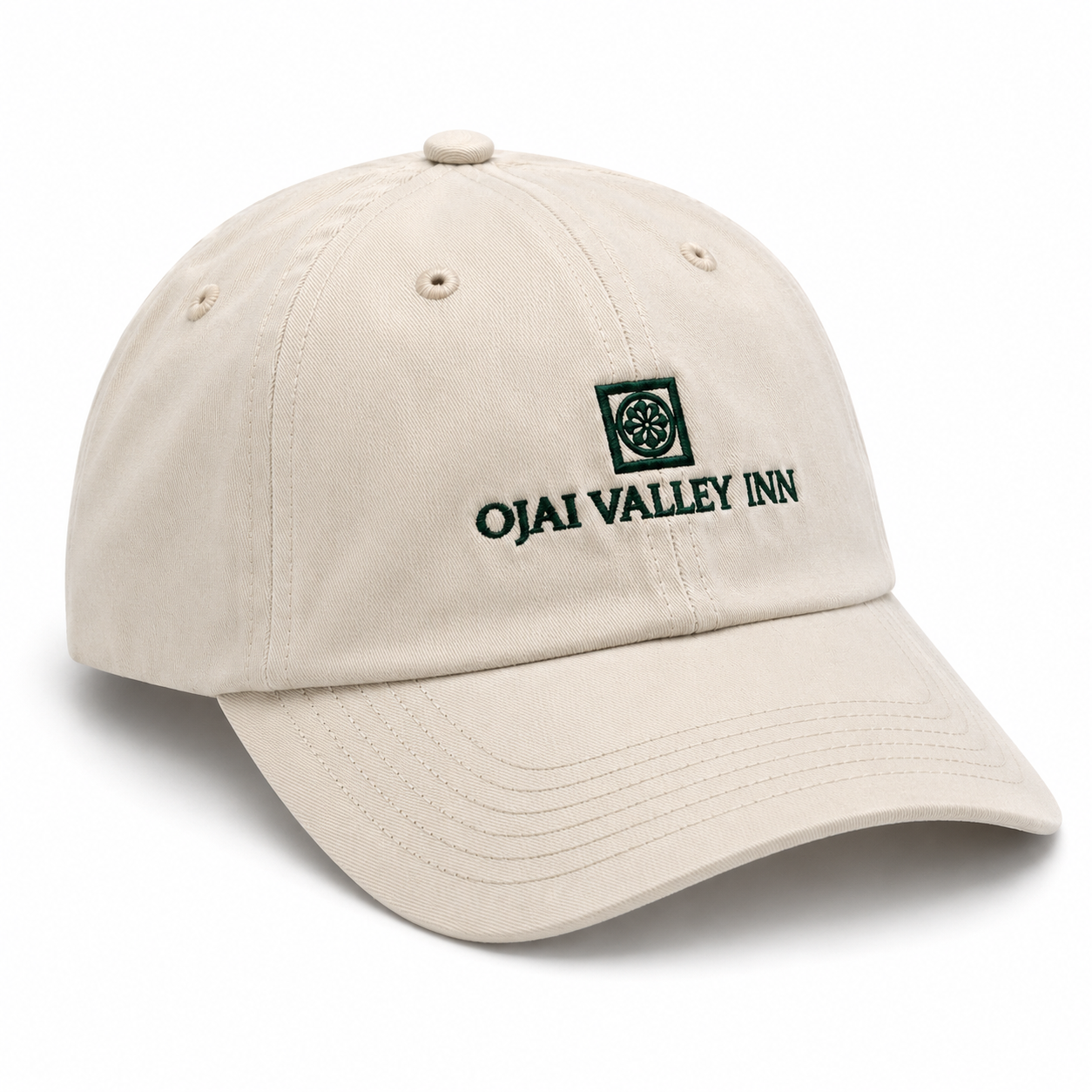 A beige baseball cap with 'OJAI VALLEY INN' and a green square logo embroidered on the front, shown on a clean white background.