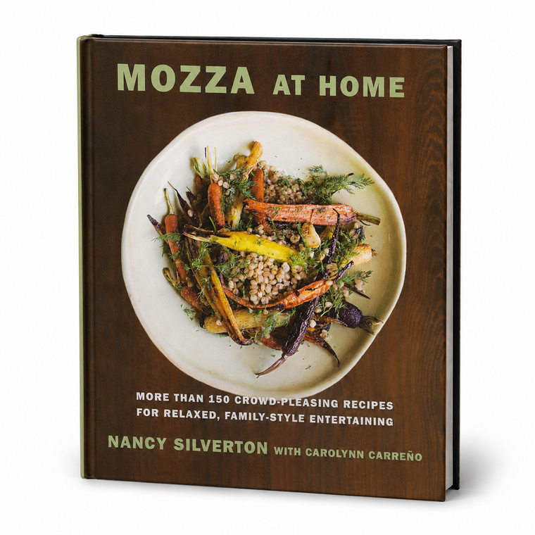 The front cover of the hardcover book 'Mozza at Home' by Nancy Silverton with Carolyn Carreño, featuring a dark brown wood-grain background and a central photograph of a plated vegetable and grain dish.