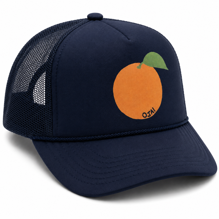 A navy blue trucker hat with a mesh back, featuring a graphic of an orange with a green leaf on the front panel. The word 'NYCO' is printed in black on the orange graphic.