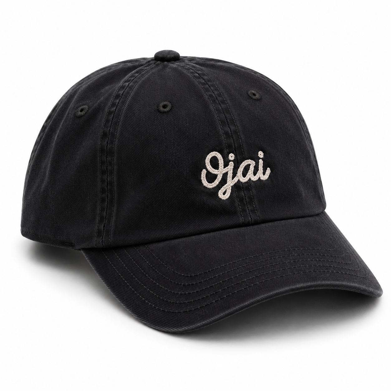A navy washed cotton baseball cap with 'Ojai' embroidered in white script on the front, shown on a clean white background.