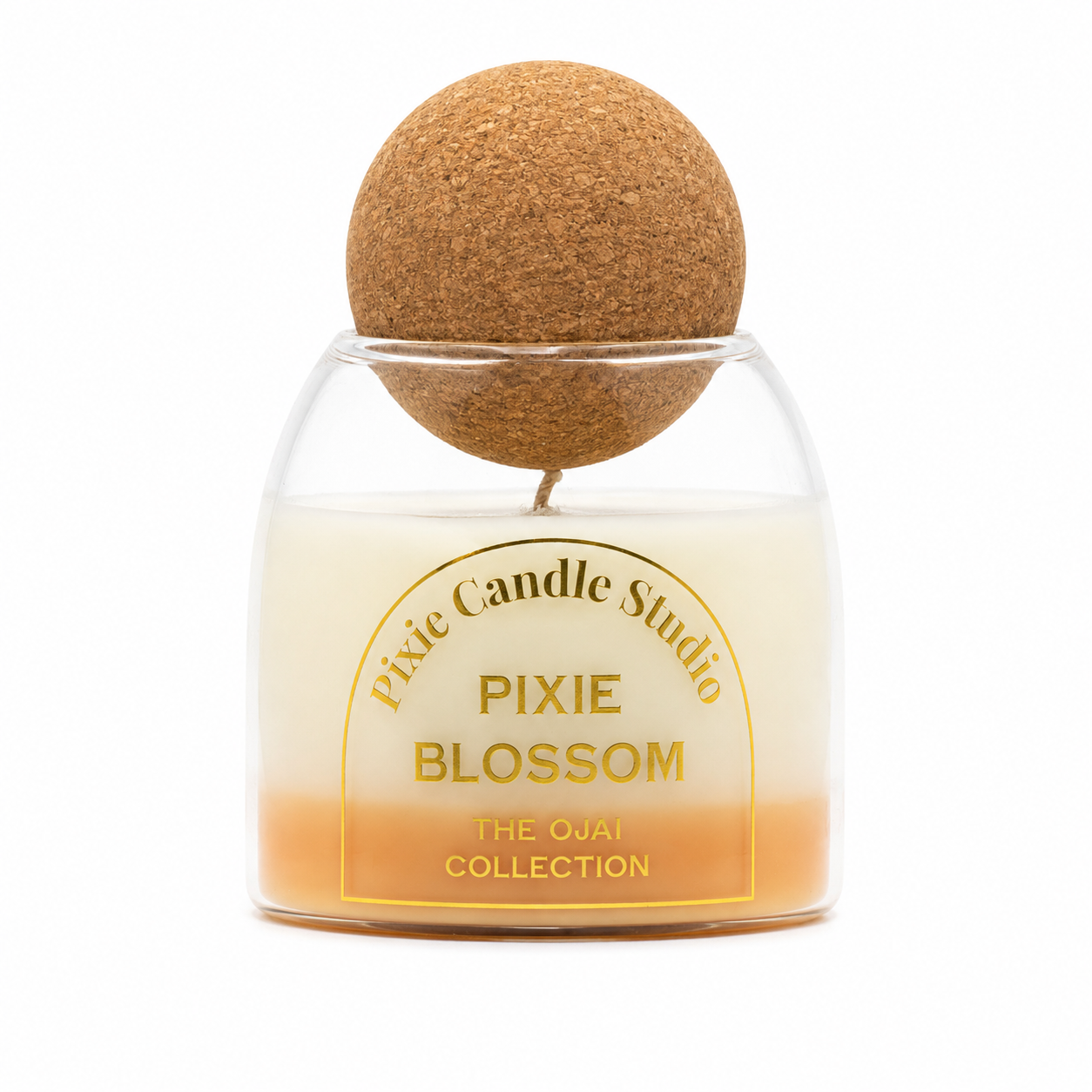 Pixie Candle Studio Pixie Blossom scented candle in a clear glass jar with an orange-to-cream gradient wax, topped with a cork ball on a white background.