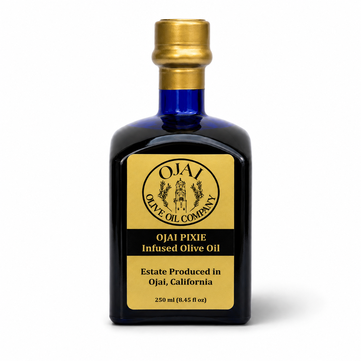 A 250 ml bottle of Ojai Pixie Infused Olive Oil by Ojai Olive Oil Company. The bottle is made of dark cobalt blue glass with a metallic gold cap and a gold and black label.