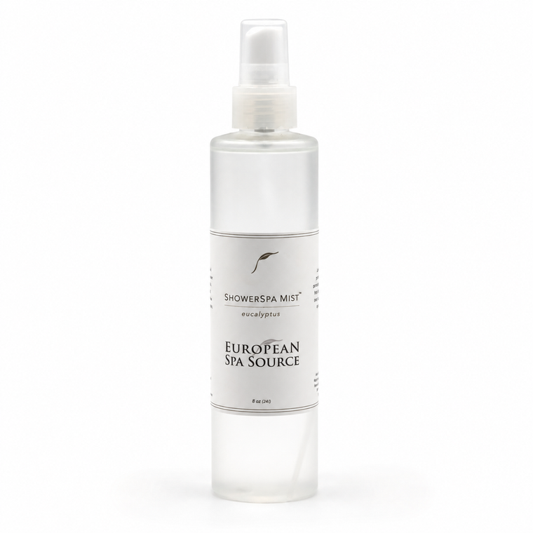 A clear plastic spray bottle of European Spa Source Shower Spa Mist with a white label and spray nozzle, set against a plain white background.