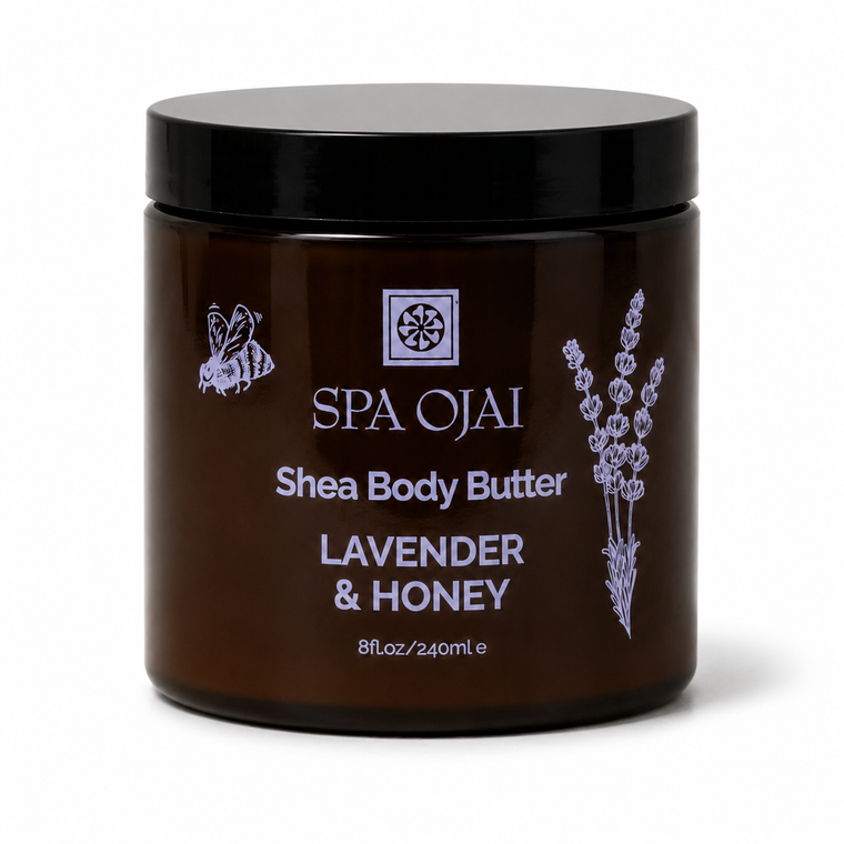A dark amber brown jar of SPA OJAI Shea Body Butter in Lavender & Honey scent, featuring a black lid and lavender illustrations on the label, set against a plain white background.