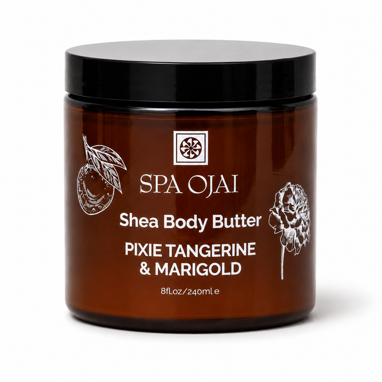 A jar of SPA OJAI Shea Body Butter in Pixie Tangerine & Marigold scent, featuring a dark amber brown jar with a black lid and white text, set against a plain white background.