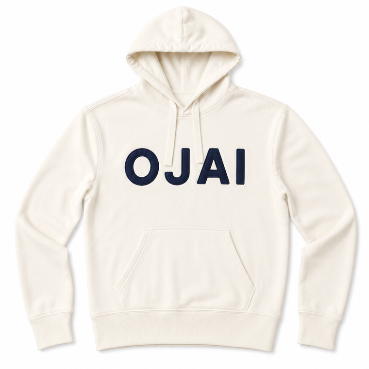 An off-white pullover hoodie with the word 'OJAI' printed across the chest in bold navy blue letters, displayed on a clean white background.
